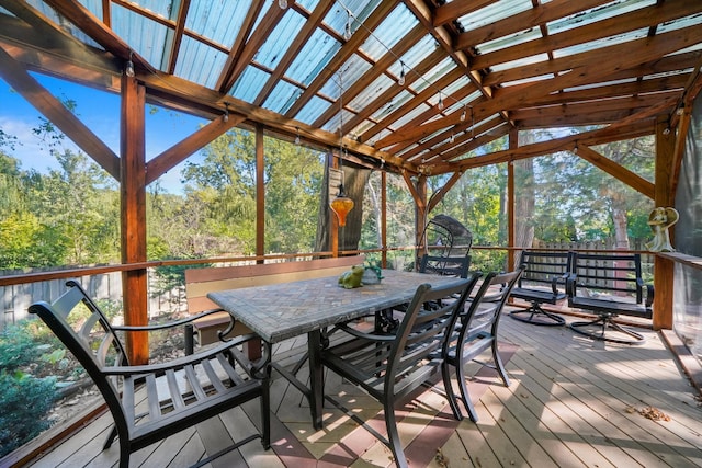 sunroom featuring lofted ceiling and a wealth of natural light