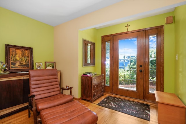 entrance foyer featuring light wood-type flooring and plenty of natural light