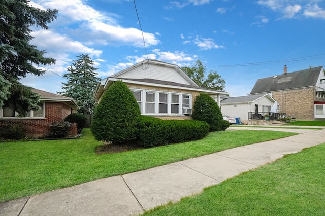 view of side of home featuring a lawn