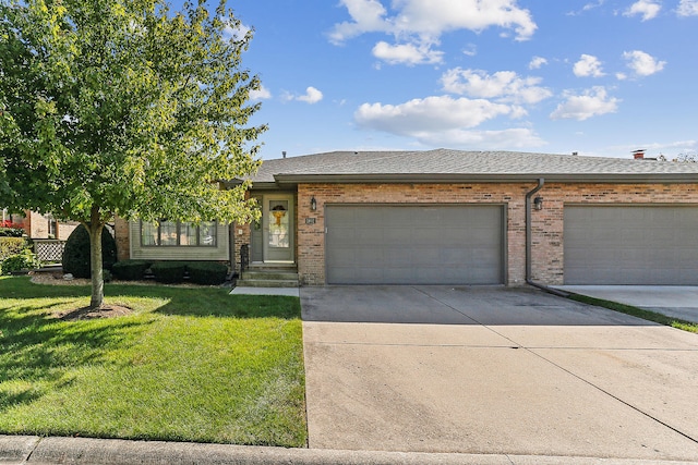 view of front of home featuring a garage and a front lawn