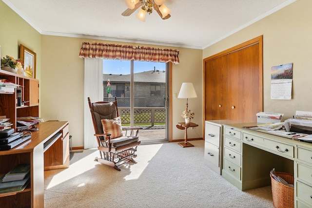 office area with a textured ceiling, crown molding, ceiling fan, and light carpet