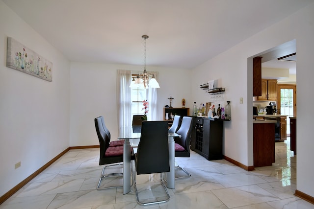 dining space featuring a chandelier