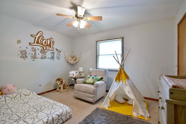 bedroom with light carpet and ceiling fan