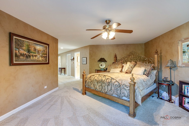 bedroom featuring ceiling fan and light colored carpet