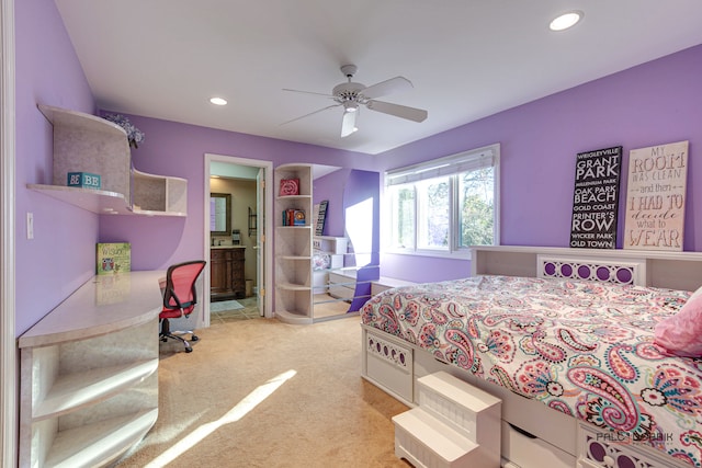 bedroom with light carpet, ceiling fan, and ensuite bathroom