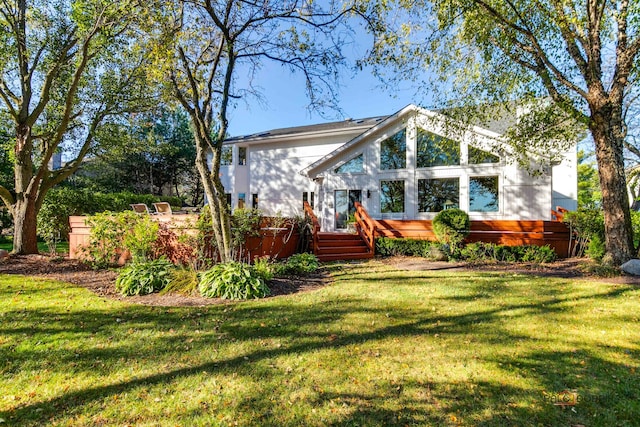 back of house featuring a yard