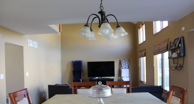 dining area featuring an inviting chandelier