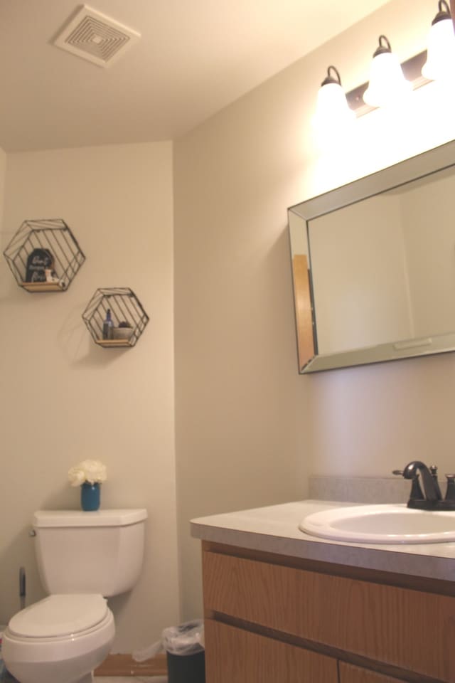 bathroom with vanity and toilet