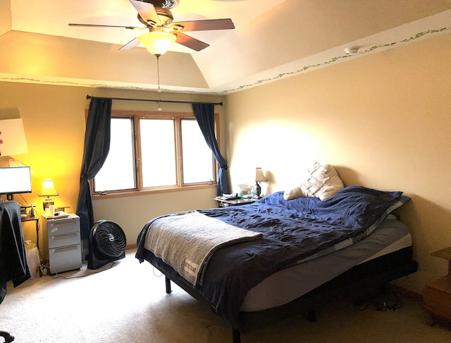 carpeted bedroom featuring lofted ceiling and ceiling fan