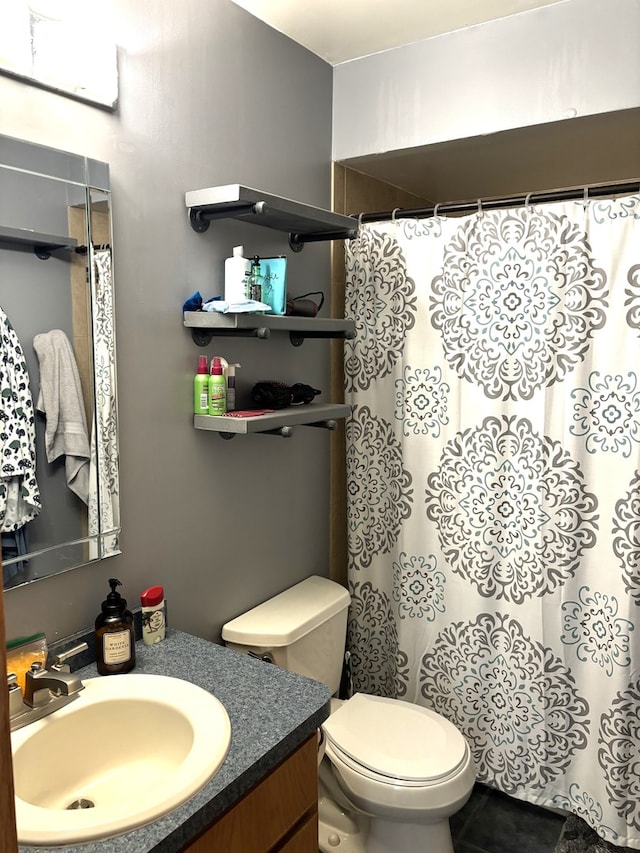 bathroom featuring toilet, a shower with curtain, and vanity