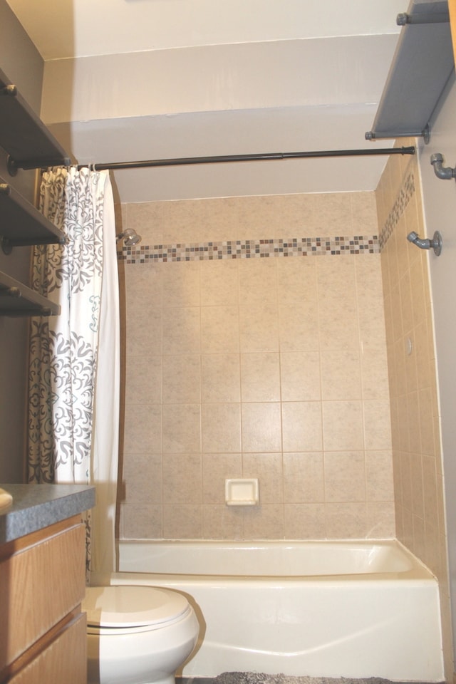 full bathroom with vanity, toilet, and shower / bath combo with shower curtain