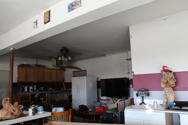 garage featuring ceiling fan and white refrigerator