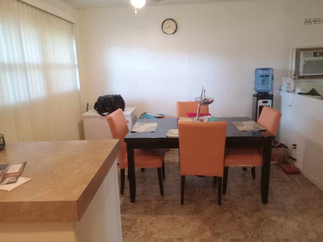 dining space featuring a wall mounted air conditioner