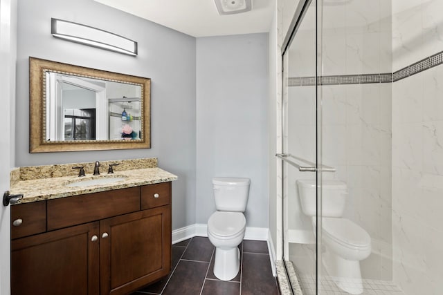 bathroom featuring toilet, tile patterned flooring, vanity, and a shower with door