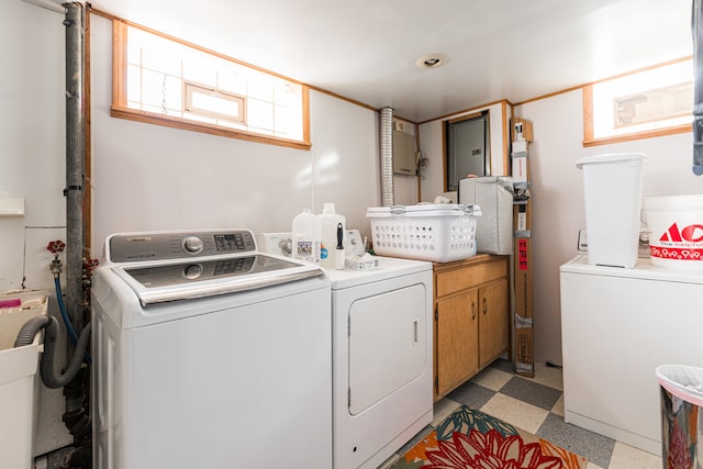 washroom with washing machine and clothes dryer