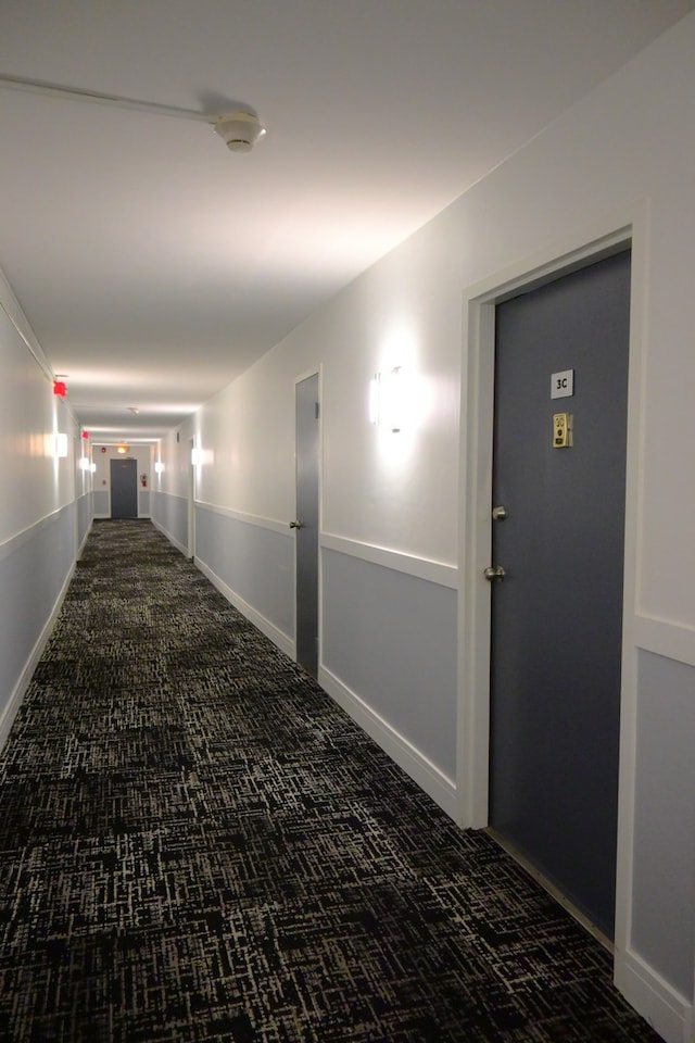 corridor with dark carpet