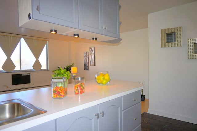 kitchen featuring sink and gray cabinets