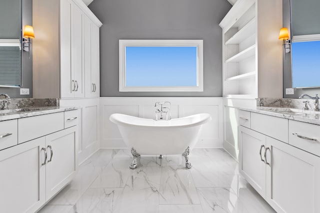 bathroom with a bathing tub and vanity