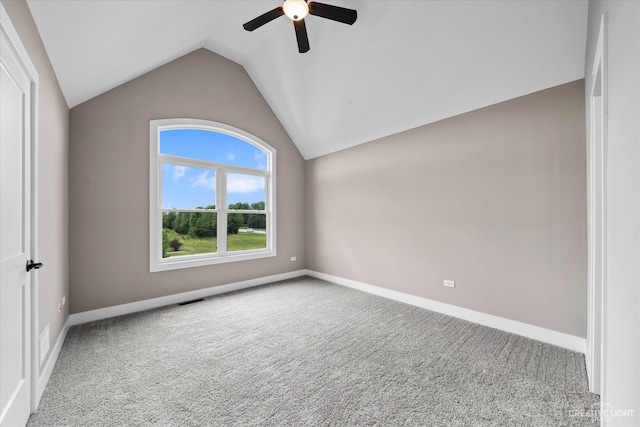 empty room with carpet, lofted ceiling, and ceiling fan