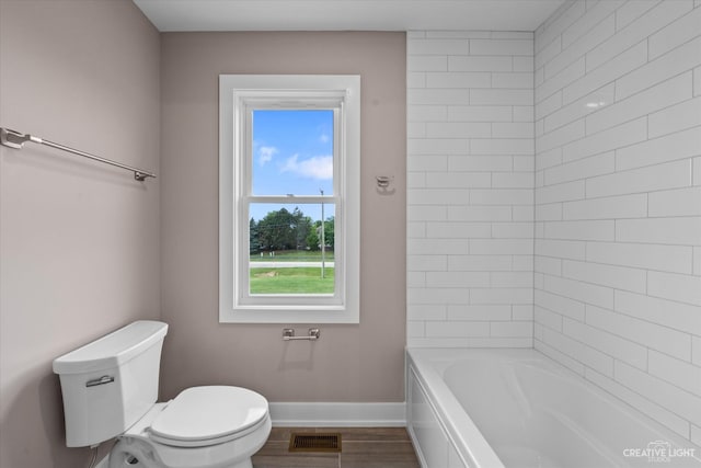 bathroom with wood-type flooring and toilet