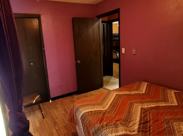 bedroom with light hardwood / wood-style floors