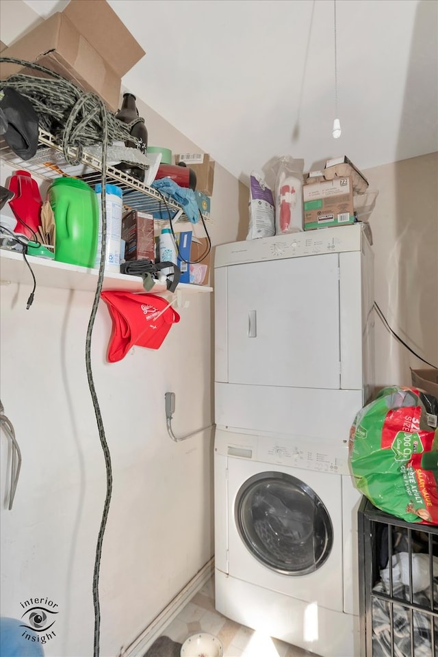 laundry area featuring stacked washing maching and dryer