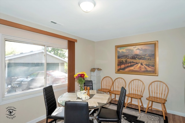 dining space featuring hardwood / wood-style floors