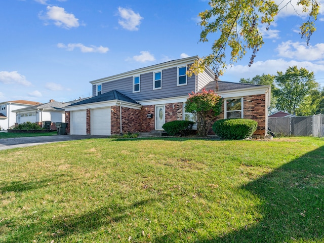 front of property featuring a front yard and a garage