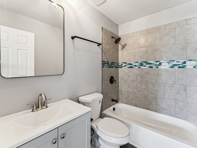 full bathroom with vanity, toilet, and tiled shower / bath