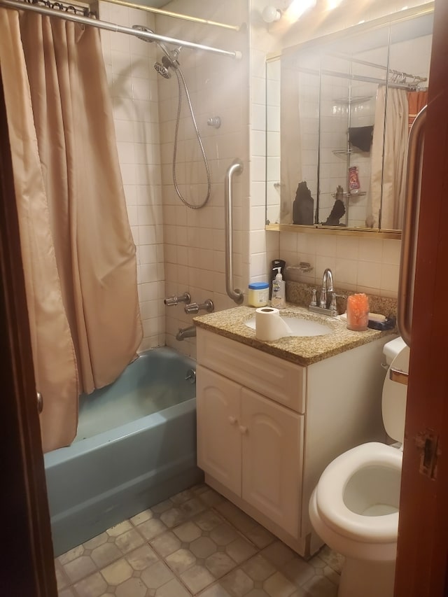 full bathroom featuring vanity, backsplash, shower / bathtub combination with curtain, tile patterned floors, and toilet