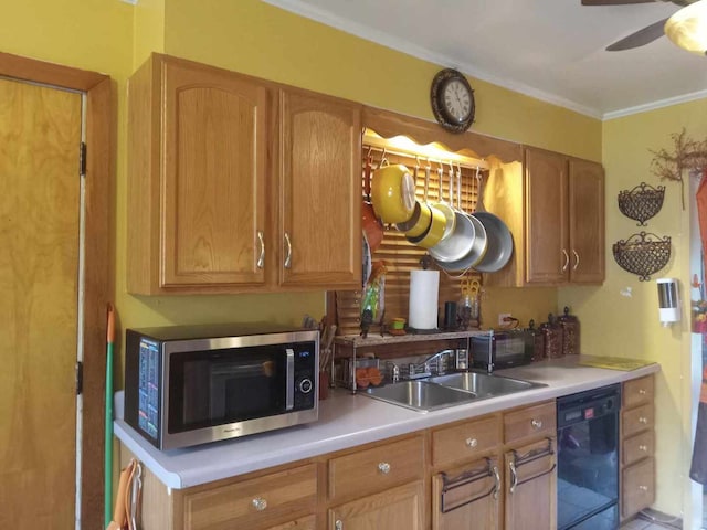 kitchen with black appliances, ornamental molding, sink, and ceiling fan