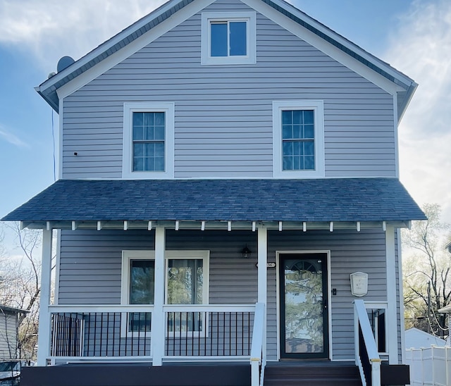 rear view of property with a porch