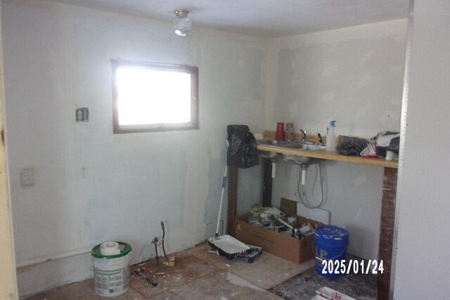 utility room featuring gas water heater