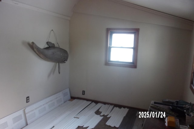 empty room featuring crown molding and light wood-type flooring