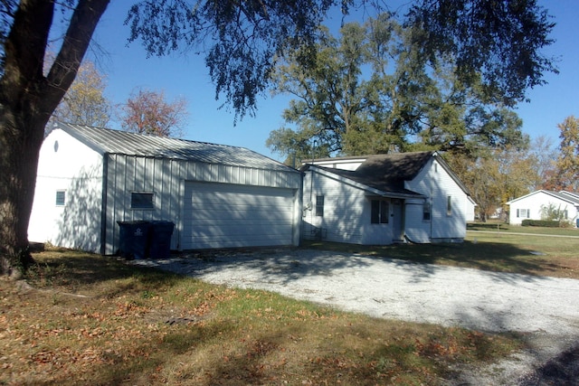 exterior space with an outbuilding and a garage