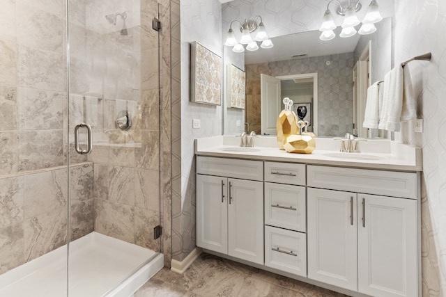 bathroom with vanity and a shower with shower door