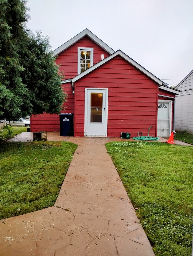 view of outbuilding featuring a yard