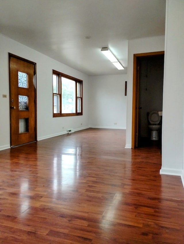 interior space with dark hardwood / wood-style floors