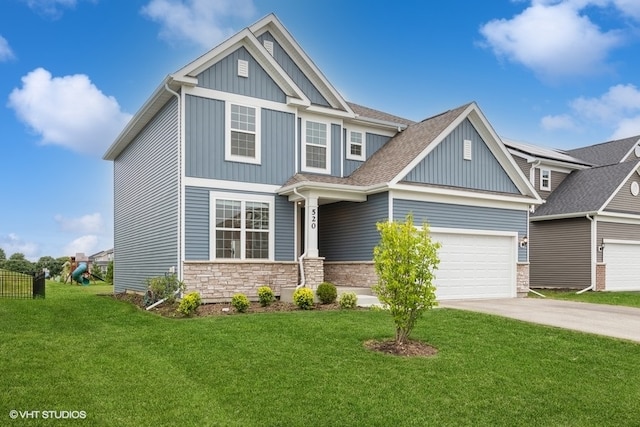 craftsman house with a garage and a front yard