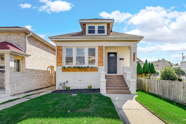 bungalow with a front lawn