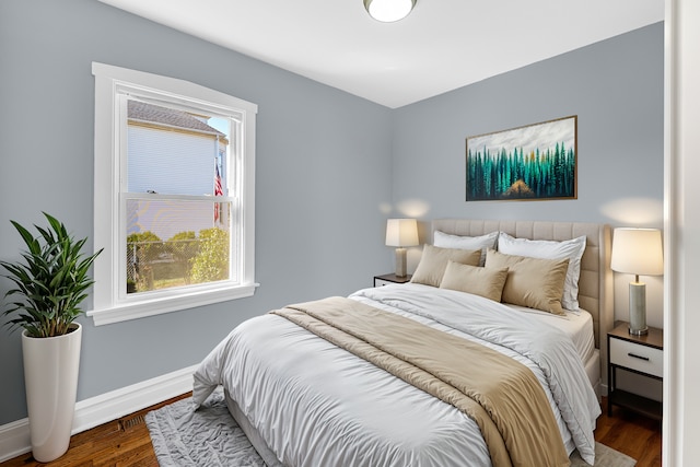 bedroom with hardwood / wood-style flooring