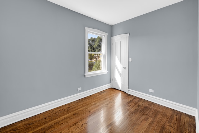 spare room featuring hardwood / wood-style flooring