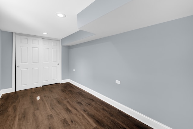 basement with dark wood-type flooring