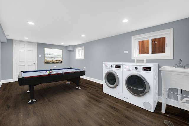 laundry area featuring billiards, dark hardwood / wood-style flooring, and washer and clothes dryer