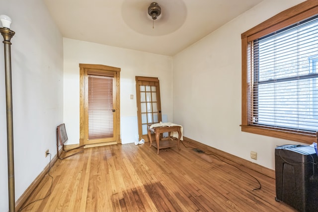 interior space with light hardwood / wood-style flooring and ceiling fan