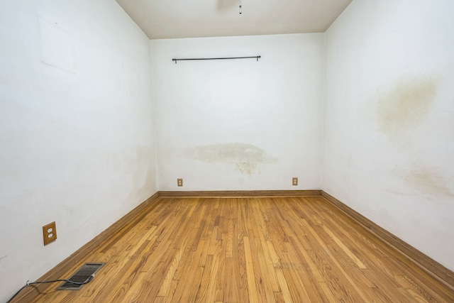 unfurnished room with light hardwood / wood-style flooring