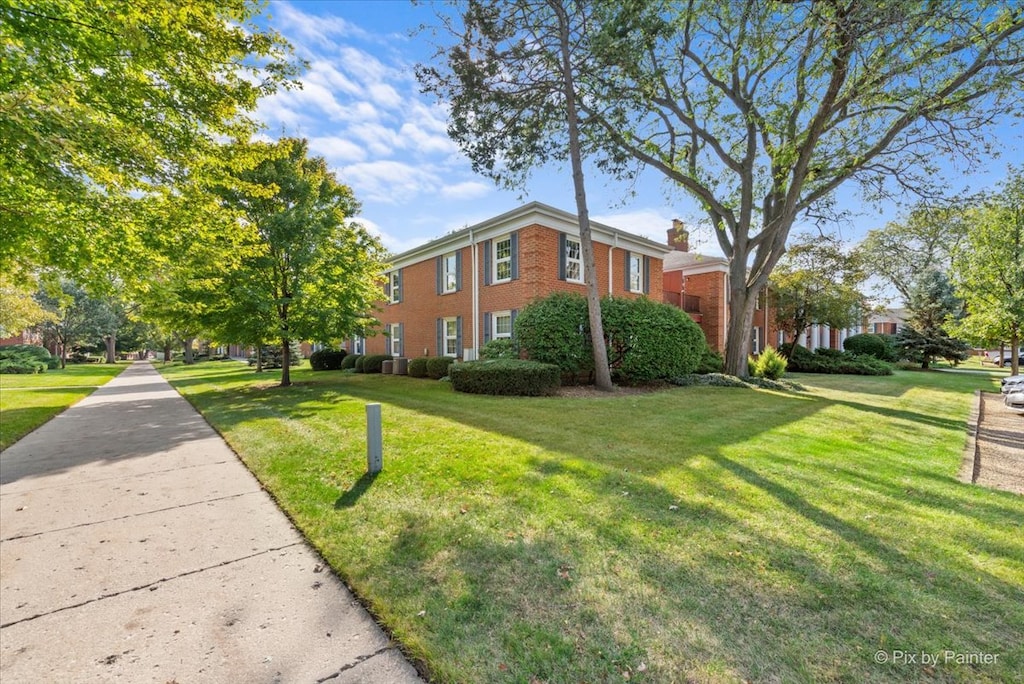 view of home's exterior featuring a yard