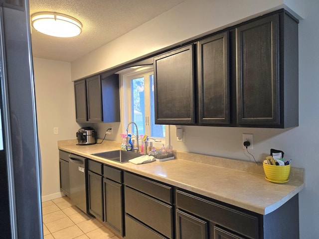 6809 S Joanne Ave, Rochelle, IL 61068 - kitchen with stainless steel appliances, light tile patterned flooring, light countertops, and a textured ceiling