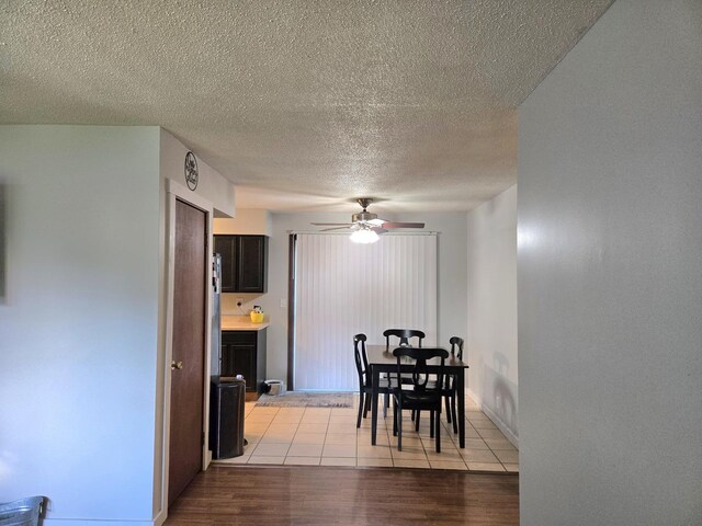 6809 S Joanne Ave, Rochelle, IL 61068 - dining area with ceiling fan, light wood-style floors, and a textured ceiling