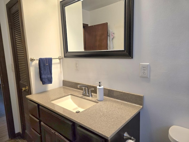 6809 S Joanne Ave, Rochelle, IL 61068 - bathroom featuring vanity and toilet